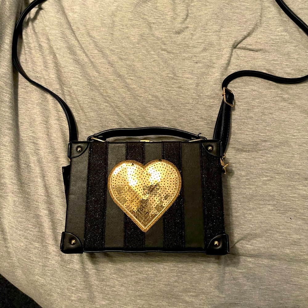Black and boxed shape bag.